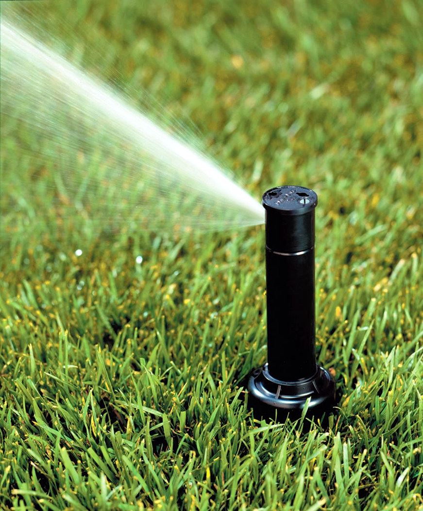 sprinkler spraying water in Alabama yard